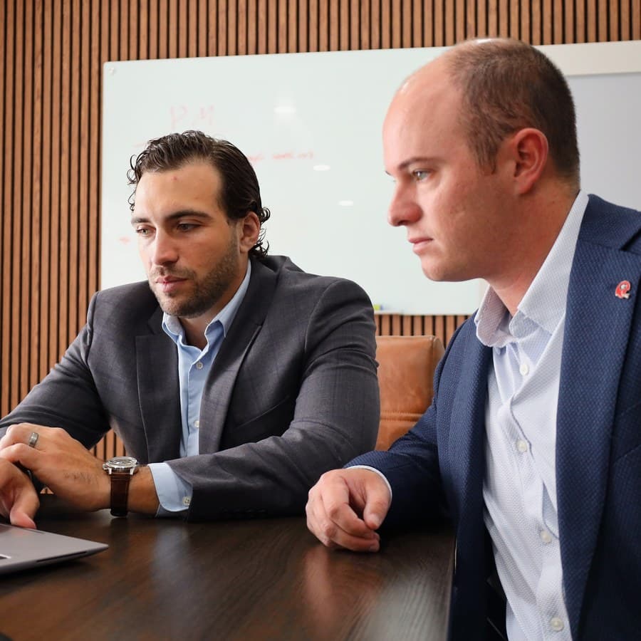 Killian Scourtis and Jimbo McCarthy working through a file together